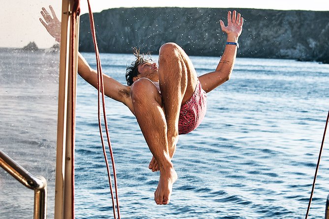 Boat Party with Swimming Stop Experience in Mykonos - From Delos Tours at Mykonos Old Port to Your Evening at Sea