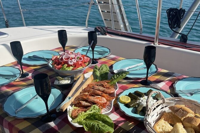 Catamaran cruise in Mykonos with Meal, Drinks & Transport - Delos archaeological stop: quick look, good photos, weather can shift it