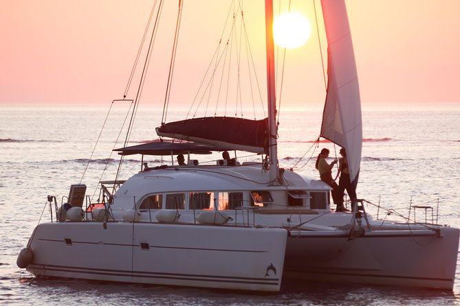 Catamaran Day & Sunset Cruises with meals Drinks and transportation - Sailing past Mykonos landmarks: Little Venice and windmills