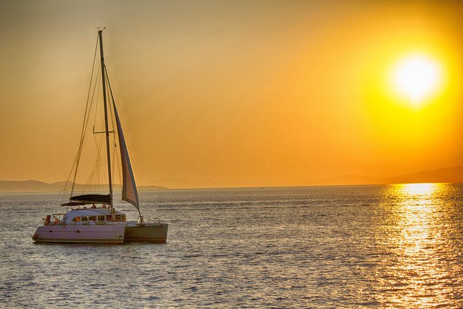 Catamaran Day & Sunset Cruises with meals Drinks and transportation - Rhenia island swim and snorkel: the main event