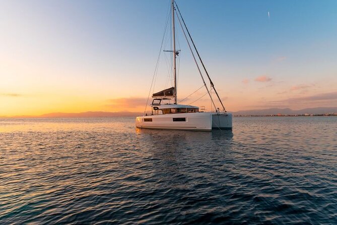 Catamaran Day & Sunset Cruises with meals Drinks and transportation - Food onboard: seafood pasta, meat options, and rose wine