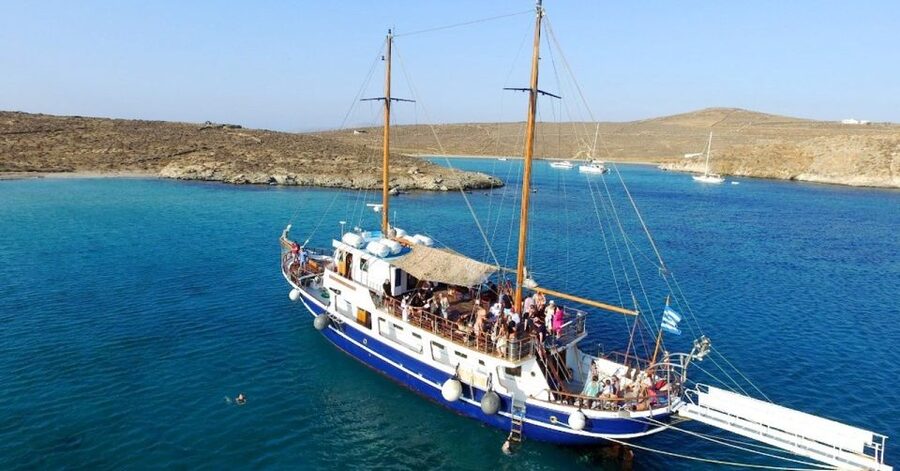 From Mykonos: Delos & Rhenia Islands Half-Day Trip by Boat - Rhenia Island Swim Time: Crystal Water, Rocky Edges, Real Water Shoes