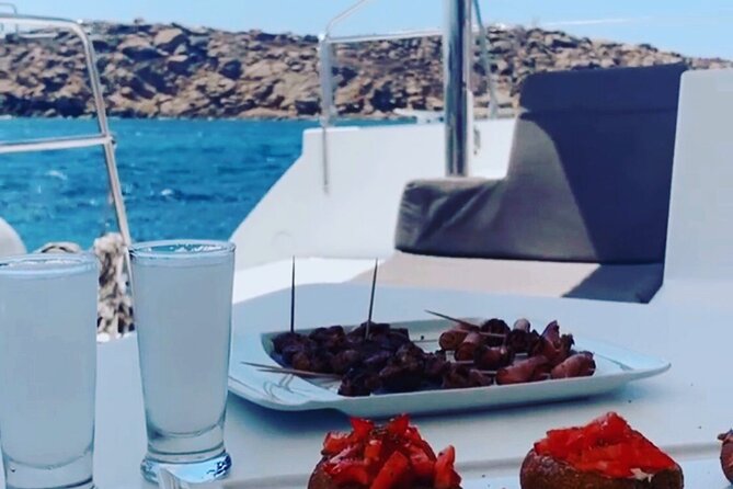 Full Day Discovering Mykonos Delos Renia Tour by Boat - Kalafatis and the South Beaches: Swim, Greek Snacks, and Local Flavor