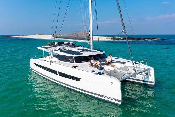 Mykonos: Brand-New Catamaran Cruise with Meal, Drinks & Transport - Getting there without stress: pickup, meeting point, and tender boats