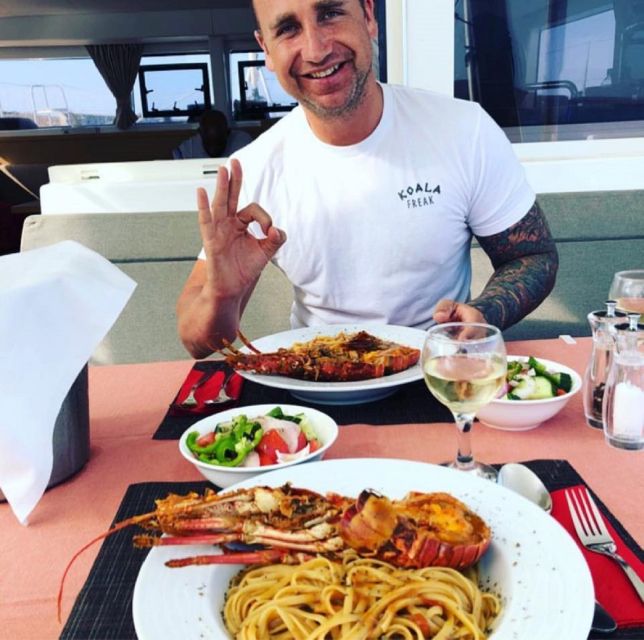 Mykonos: Full-Day Catamaran Cruise with Fresh Lunch - Lunch onboard: seafood pasta, salads, and the drinks that keep it effortless