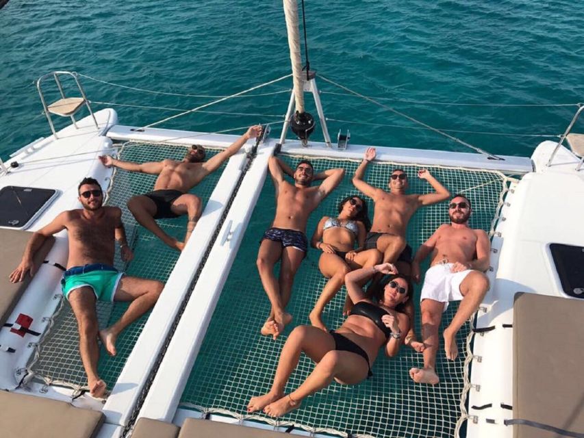 Mykonos: Full-Day Catamaran Cruise with Fresh Lunch - Sailing past Agios Ioannis, Ornos, Psarou, and the rest of the famous stretch