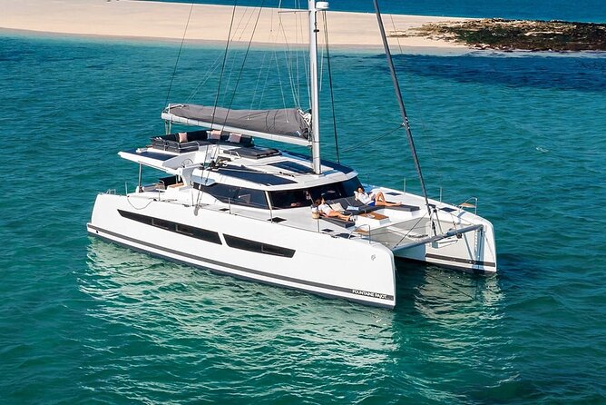 Mykonos: Luxury Catamaran Cruise with Meal, Drinks & Transport - Getting to Agia Anna and the tender-boat reality