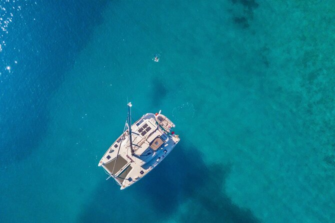 Mykonos: Private Catamaran Cruise—Hotel Pickup, BBQ & Drinks - Delos in an Hour: Apollo, Mosaics, and the Dolphin House