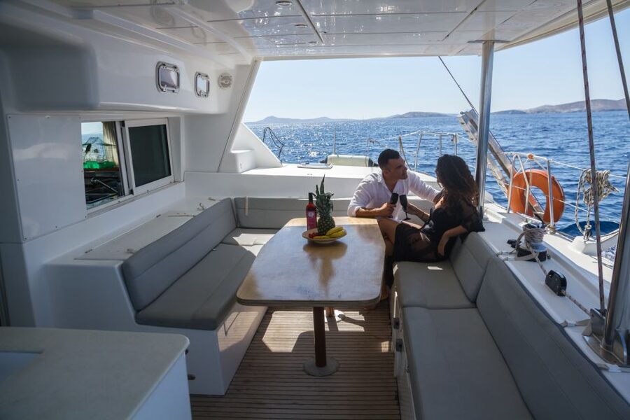 Mykonos: Private Catamaran Cruise w/ Food, Drinks & Transfer - Sailing Back with Windmills Views (and Sunset Option)