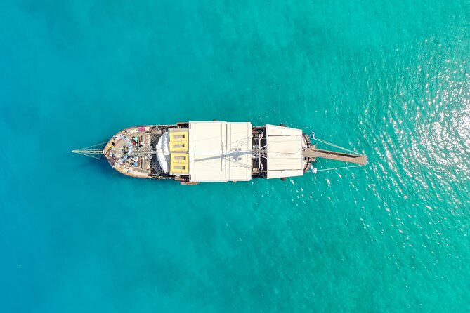 Mykonos Sunset Boat Party Little Venice - Agios Stefanos swim stop: sandy beach time from the boat