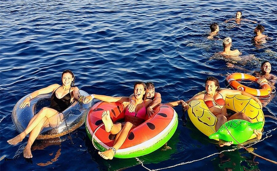 Mykonos: Sunset Boat Party with Open Bar & Live DJ - Swim stops and floating fun: inflatables, a jumping board, and clear water