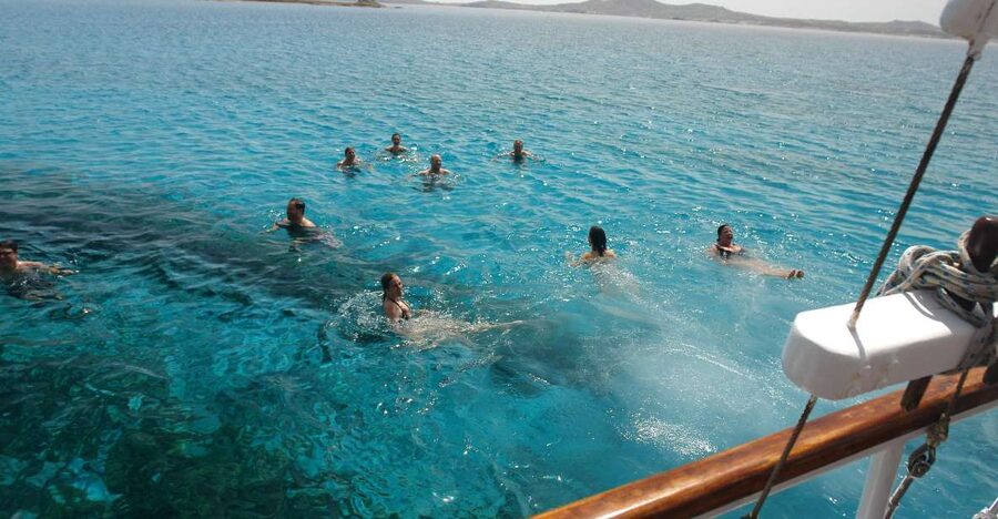 Mykonos: Sunset Party Boat Cruise with 1 Drink - Checking In at Aegean Ventures Kiosk, Then Off on Mykonos Time