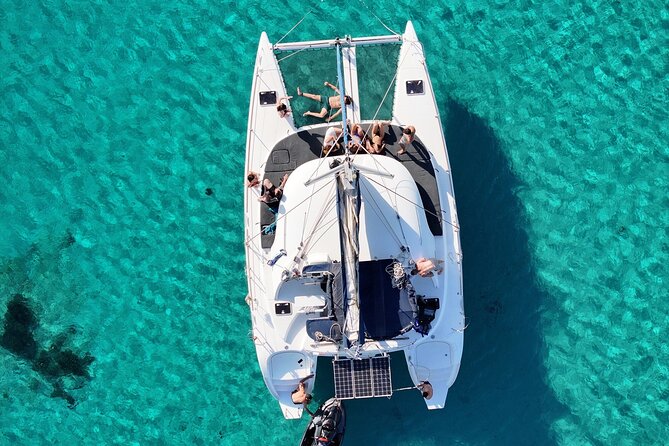 Private Mykonos Catamaran Day Cruise with Meals & Water Toys - Stop 2: Delos stop and that ruins-or-swim choice