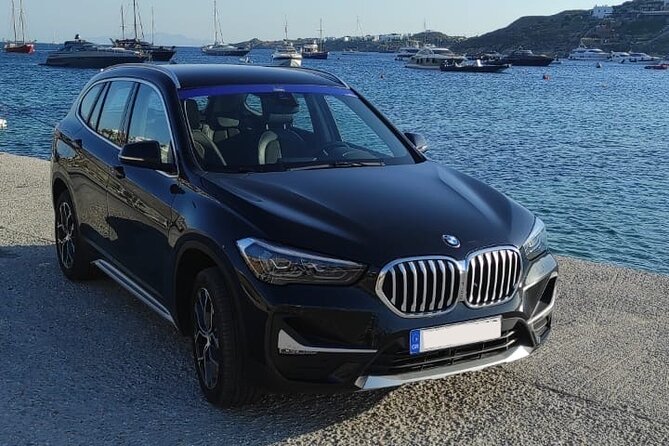 Private Transfer Service All Around Mykonos Island - 1 WAY - WhatsApp pickup and car-plate details on a busy island