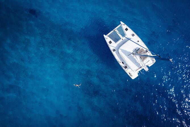 Semi Private Cruise with luxury Catamaran in Delos and Rhenia islands - Rhenia Island Swim Stop: Calm Water Time and Snorkeling-Friendly Fun